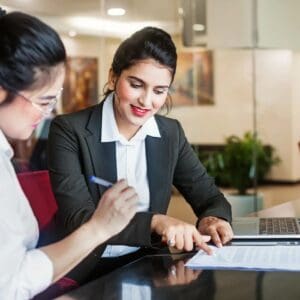 Two women are working on a project together.